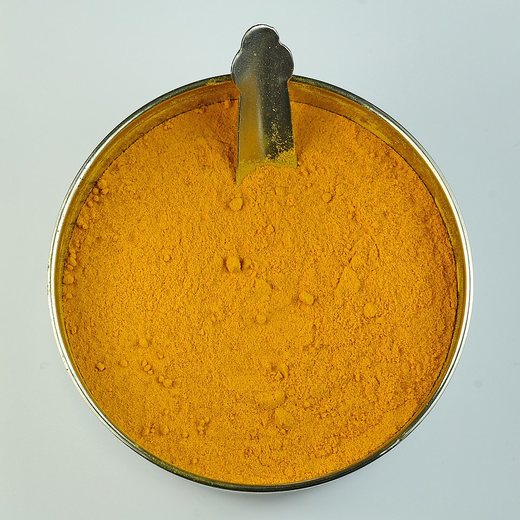 Golden turmeric powder in a bowl